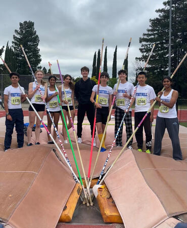 Aman, L, with his pole vault team